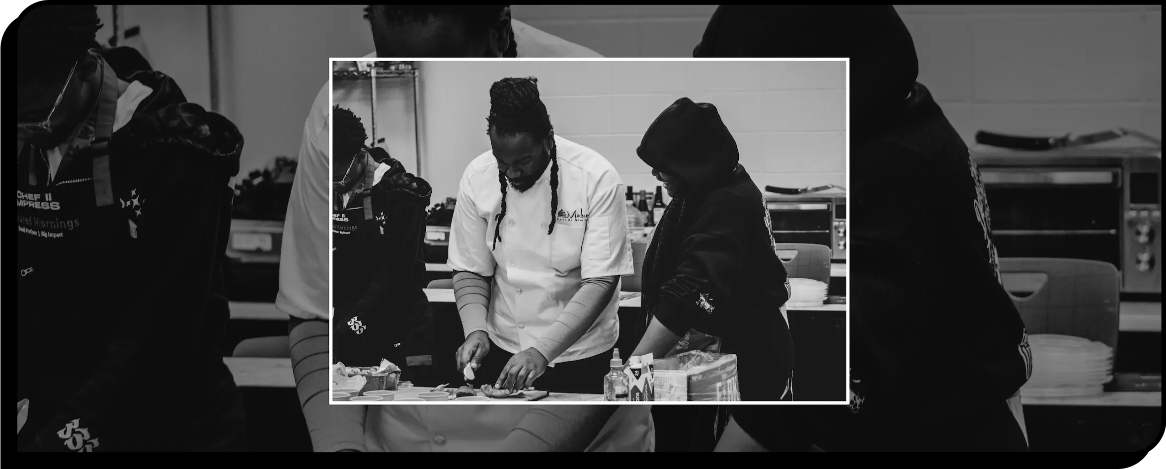Chef showing a student how to cook